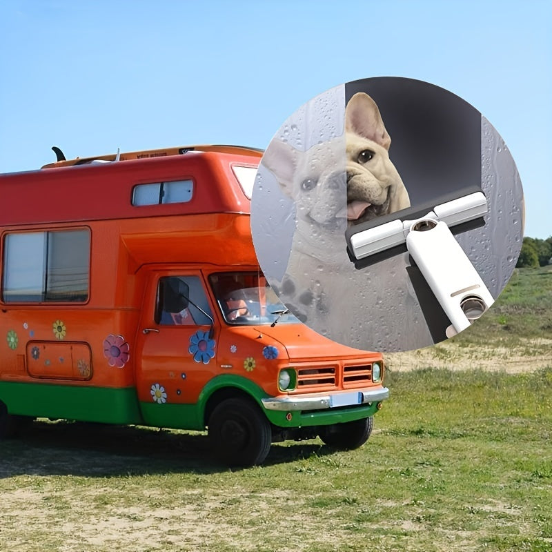 Orange camper van with a dog and squeegee in a field
