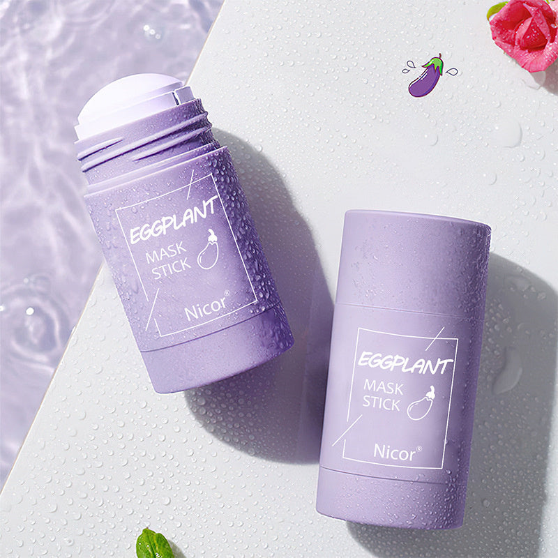 Two purple eggplant mask sticks with Nicor branding on a textured white background.
