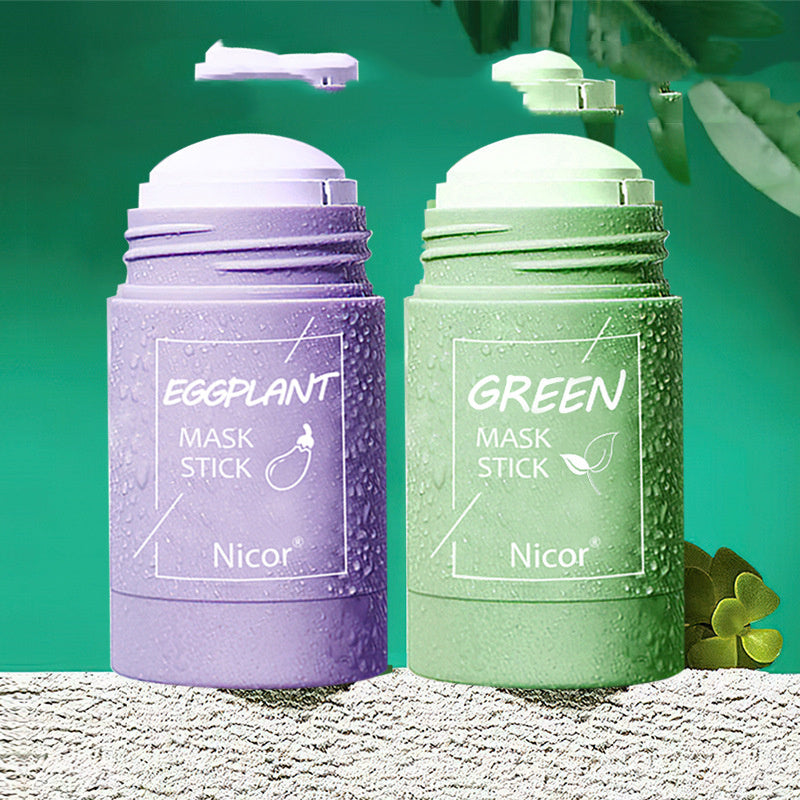Purple and green mask sticks with 'Nicor' branding on a textured surface with green leaves.
