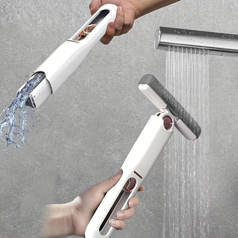 Handheld showerhead with water flowing from it against a gray background